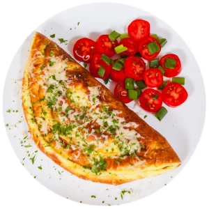 Omelet on a plate with tomatoes